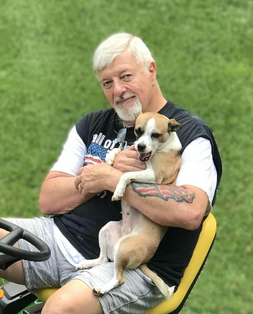 Dennis Sullivan holding his dog